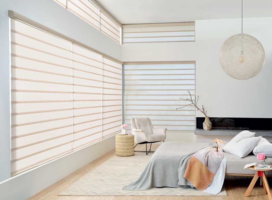 Airy bedroom with vignette modern roman shades