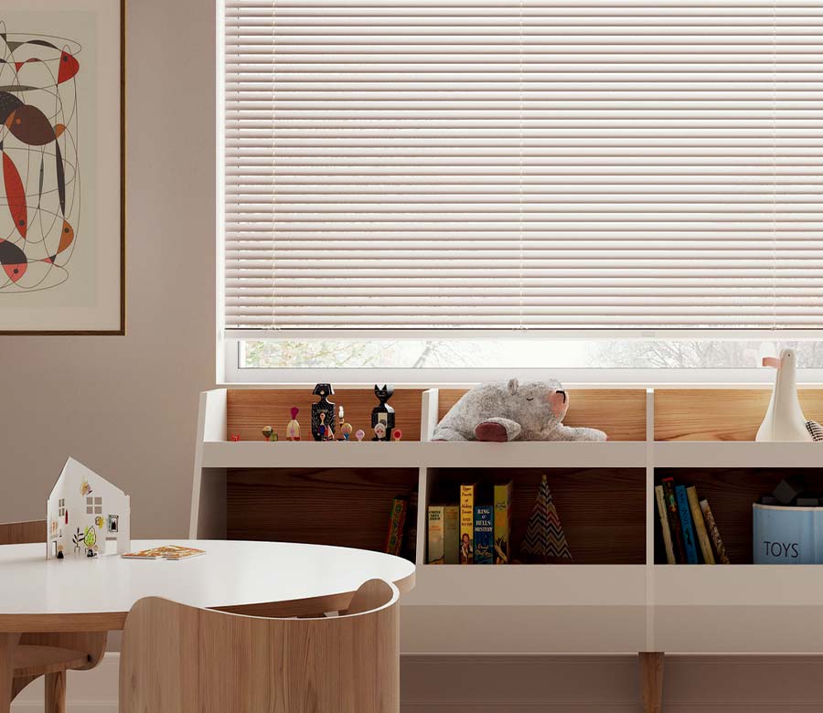 kids playroom with books and toys and beige blinds in Little Canada, MN